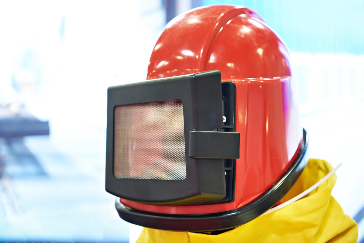 Protective blast suit and helmet on a mannequin in the workshop
